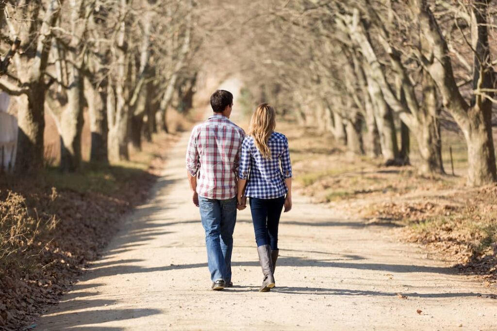 Couple holding hands on a walk